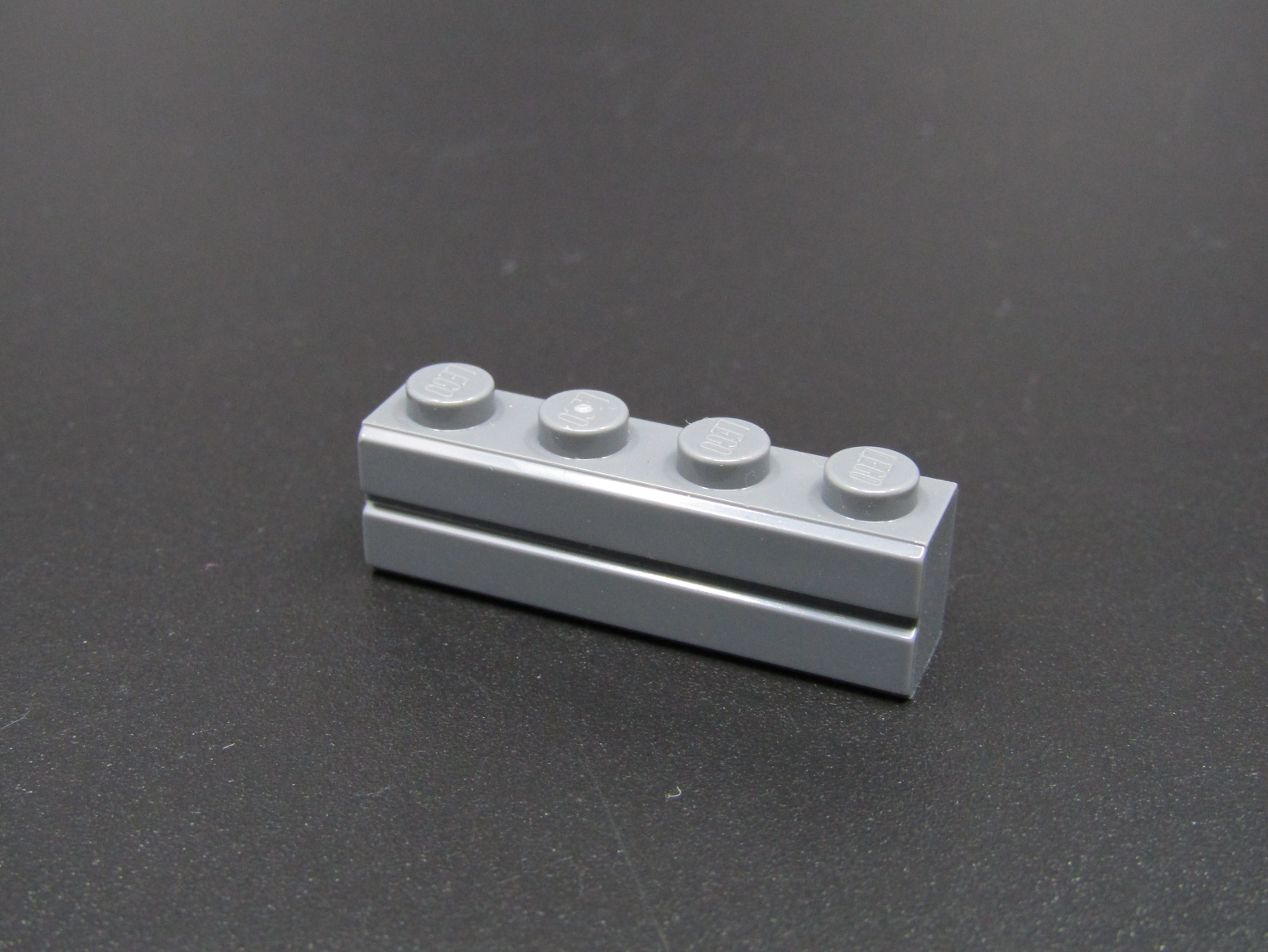 Lego kostička speciální - cihla 1x4 - tmavě šedá - dark bluish gray