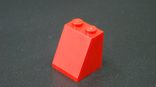 Lego kostička šikmá 65 2x2 - tmavě červená