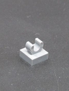 Lego speciální kostička s klipem 1x1 - tm.šedá - dark bluish gray