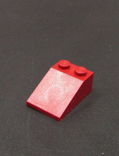 Lego šikmá kostka 33 3x2 tmavě červená
