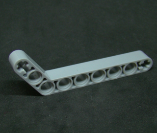 Lego Technic rameno ohnuté 1x9 (7-3) - světle šedé - light bluish gray