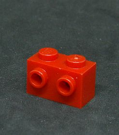 Lego kostička speciální 1x2 s nopy - červená