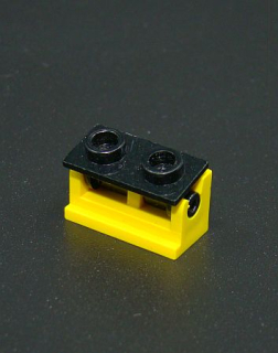 Lego kostička - pant - žluto-černý