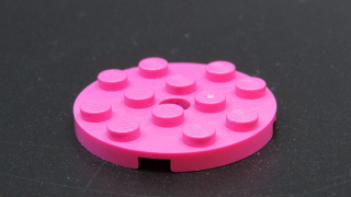 Lego destička kulatá s kulatou středovou dírou - tmavě růžová