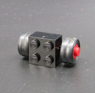 Lego náprava s kostkou s koly 2x2 - černá