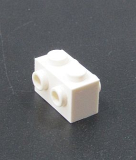 Lego kostička speciální s výstupky na obou stranách - bílá